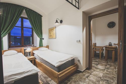 Säng eller sängar i ett rum på Penzion Šatlava