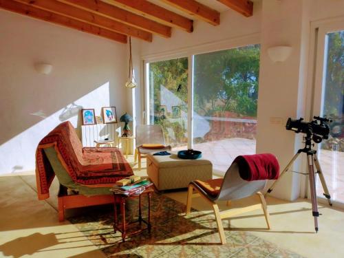 a living room with a camera and a camera tripod at Milagro de Algar in Vejer de la Frontera
