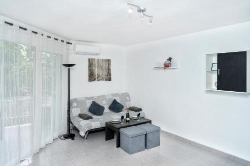 a living room with a couch and a table at Lorena in Salou