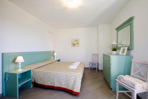 Ένα ή περισσότερα κρεβάτια σε δωμάτιο στο Appartamenti Borgo San Pietro