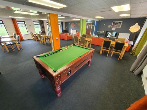 a office with a pool table in a room at Basecamp Wales in Llanllyfni