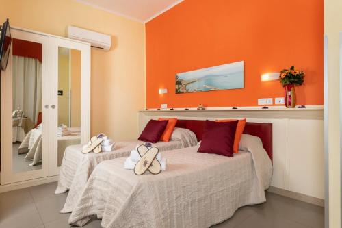 Postel nebo postele na pokoji v ubytování Capodichino International Hotel