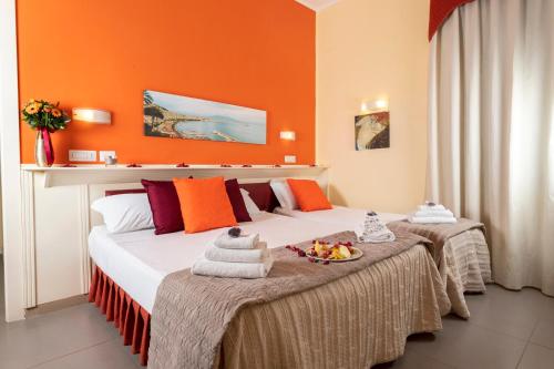 Postel nebo postele na pokoji v ubytování Capodichino International Hotel