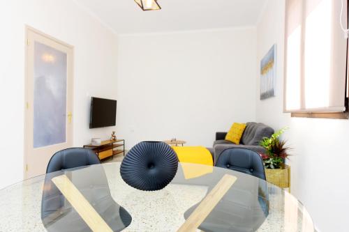 a living room with a glass table and chairs at Alion House in Rhodes Town