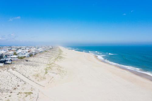 an aerial view of a beach with houses and the ocean at Surf City Hotel in Surf City