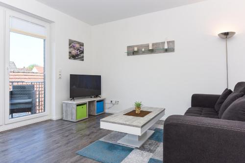 TV a/nebo společenská místnost v ubytování Ferienwohnung Rosalinde
