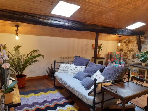 a living room with a couch and a table at Al Alba Vivienda Vacacional VV1865AS in Illas