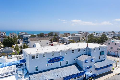 an aerial view of a blue building in a city at Surf City Hotel in Surf City