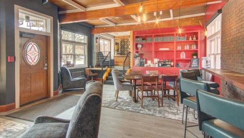 a living room with a table and chairs at The Bristol Hotel in Steamboat Springs