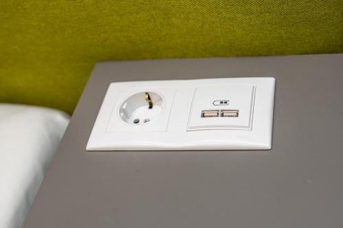 a white scale sitting on top of a table at Hotel Amel Rooms in Mediaş