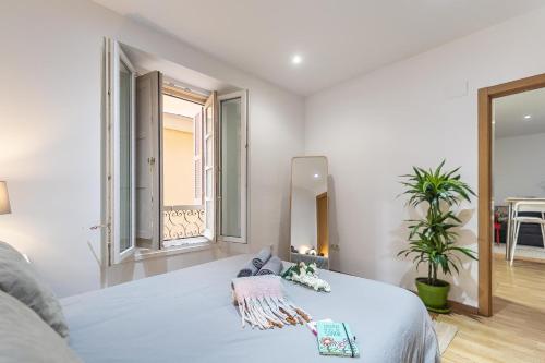 Postel nebo postele na pokoji v ubytování Boutique Mitjana Apartment