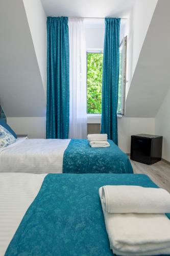 Postel nebo postele na pokoji v ubytování Hotel Amel Rooms