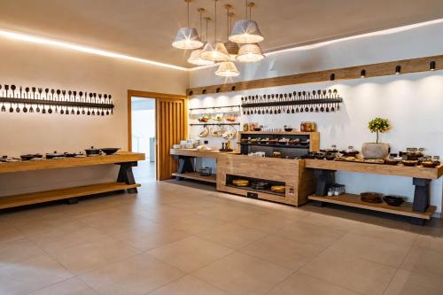 a wine tasting room with a bunch of wine bottles at Aeolos Resort in Mýkonos City