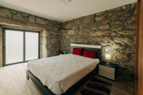 Säng eller sängar i ett rum på Lamegos GuestHouse