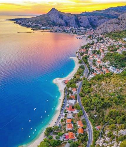 an aerial view of a beach and the ocean at Apartments Mimac in Omiš