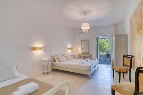 Ένα ή περισσότερα κρεβάτια σε δωμάτιο στο Dahlia Apartments And Studios