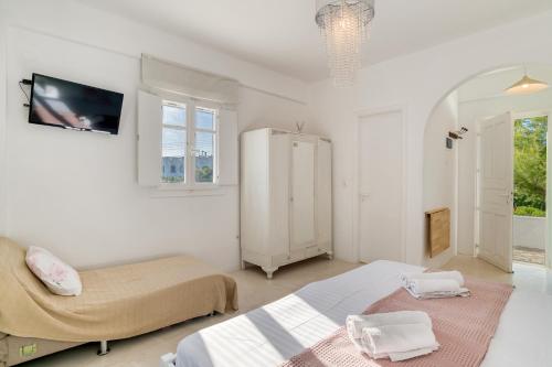 Posteľ alebo postele v izbe v ubytovaní Dahlia Apartments And Studios