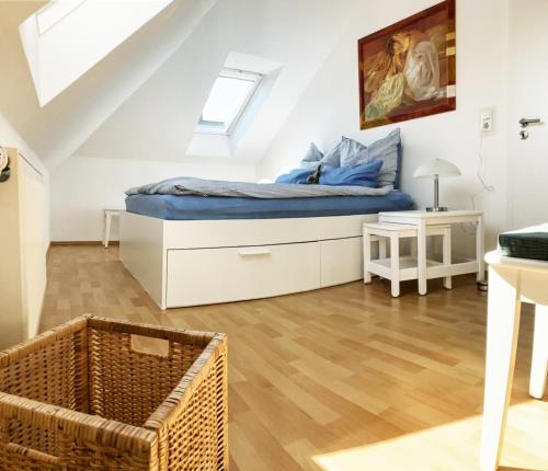 a bedroom with a bed in a attic at Antje's Ferienwohnung Rastede in Rastede