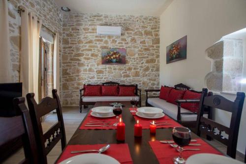 a dining room with a table and chairs and a couch at Iris house Sivas (Ex. Sivas Villa 1) in Sívas