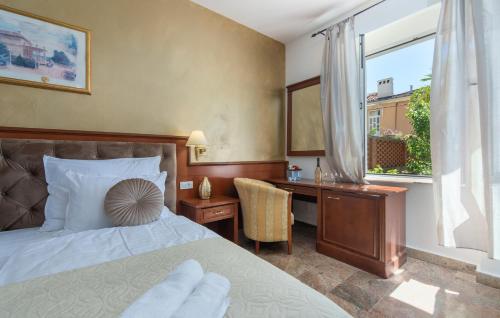 Ένα ή περισσότερα κρεβάτια σε δωμάτιο στο Royal Suite Opatija