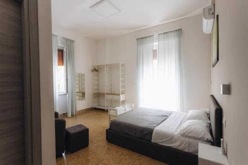 a bedroom with a bed and a window at THE NEST - Luxury suites in Pescara