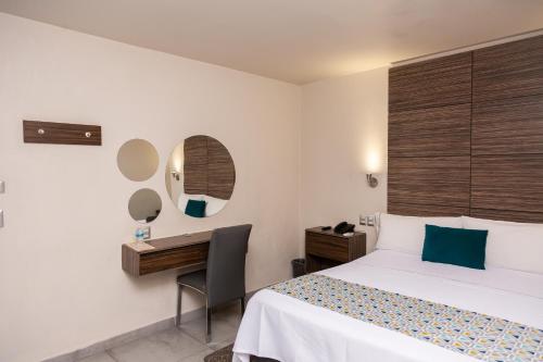 Postel nebo postele na pokoji v ubytování Hotel Expo Abastos