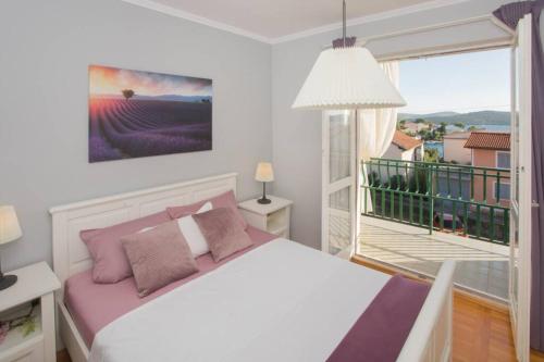 Postel nebo postele na pokoji v ubytování Dalma Residence apartman Lavandella