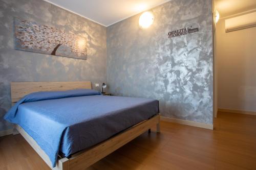 Qualità è Amore ROOMSにあるベッド