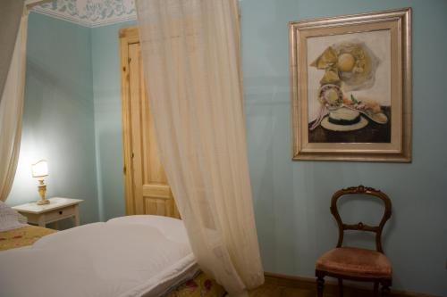 Postel nebo postele na pokoji v ubytování ex BENEFICIO di Santa MARIA della SCALA B&B de Charme