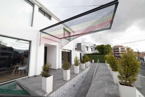 a balcony of a house with potted plants at Luxury Room KAIA - Best Place in Quito in Quito