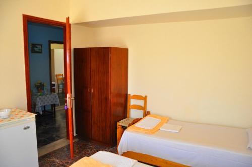 A bed or beds in a room at Vai Rent Rooms