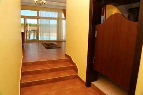a hallway with stairs leading to a room at Hotel & Resort Golden Marina Yanbu in Yanbu