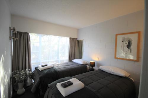 Posteľ alebo postele v izbe v ubytovaní Beach Lodge Motels