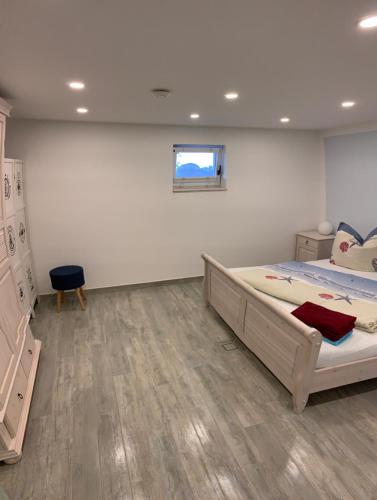 a bedroom with two beds and a window on the wall at Ferienwohnung Am Müritz Seeufer in Waren