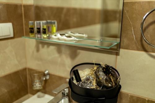 a basket sitting on top of a sink in a bathroom at Konak Vuk in Nova Varoš