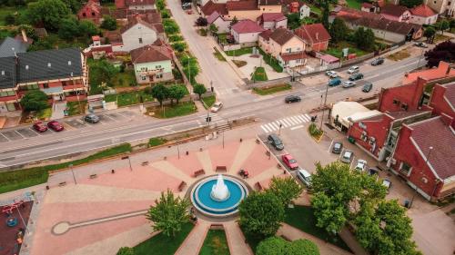 an aerial view of a city with a clock tower at Kuca Magnolija in Nuštar