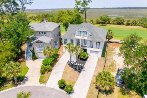 an aerial view of a house with palm trees at Fairway to Heaven in Fripp Island