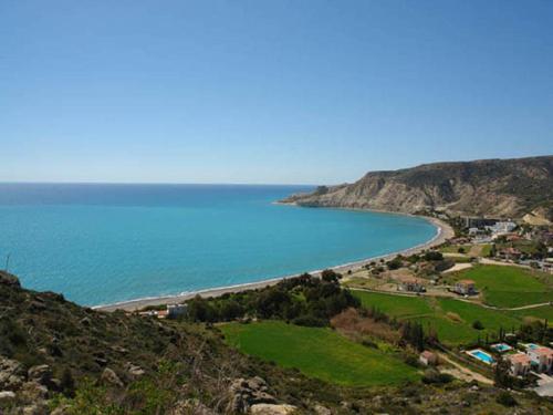 a view of a beach from a hill at Katikies 22 in Pissouri