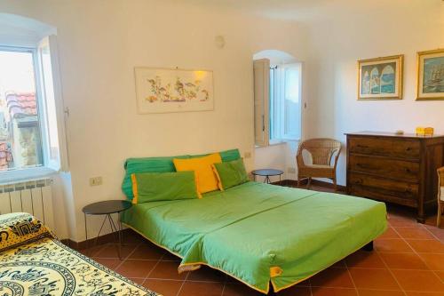 Ein Bett oder Betten in einem Zimmer der Unterkunft La Torretta dei Poeti, Tellaro