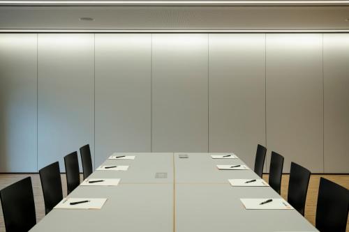 a long table in a conference room with chairs at Montfort - das Hotel in Feldkirch