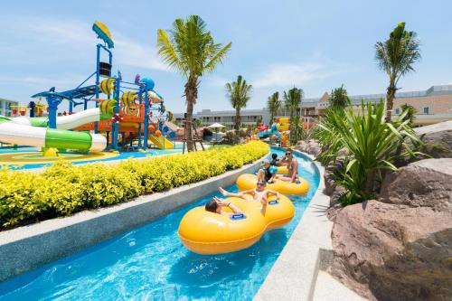 a water park with people riding on inflatable tubes at The Sands Khao Lak by Katathani - SHA Extra Plus in Khao Lak