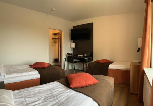 Säng eller sängar i ett rum på Slagsta Motell & Wärdshus