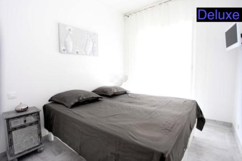Un ou plusieurs lits dans un hébergement de l'établissement Appartements Cannes Centre Ville