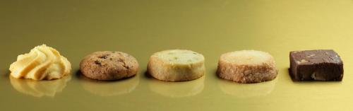 a group of four different types of pastries on a table at Milano Verticale | UNA Esperienze in Milan