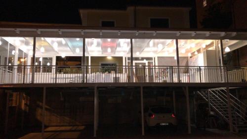 a view of a house with a balcony at night at Villa Scotillo Boutique Hotel in Agropoli