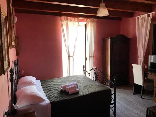a bedroom with a bed and a window at Villa Scotillo Boutique Hotel in Agropoli
