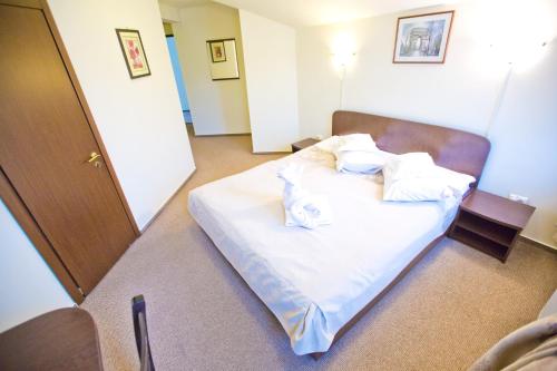 Postel nebo postele na pokoji v ubytování Hotel Piemonte