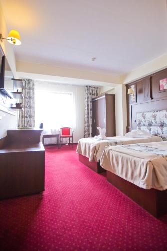 Postel nebo postele na pokoji v ubytování Hotel Piemonte