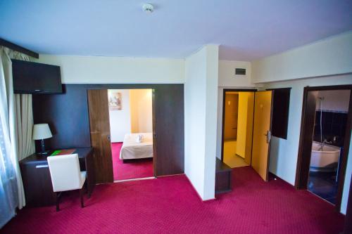 Postel nebo postele na pokoji v ubytování Hotel Piemonte