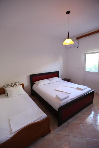 Ліжко або ліжка в номері Vila Enea
